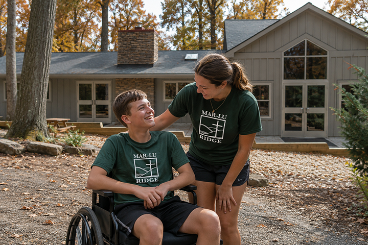Counselor connects with wheelchair-bound camper