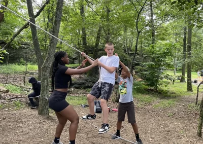campers on the ropes course